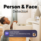 Living room scene with a toddler at a dresser and a Lorex Connect camera on the right showing Person and Face Detection