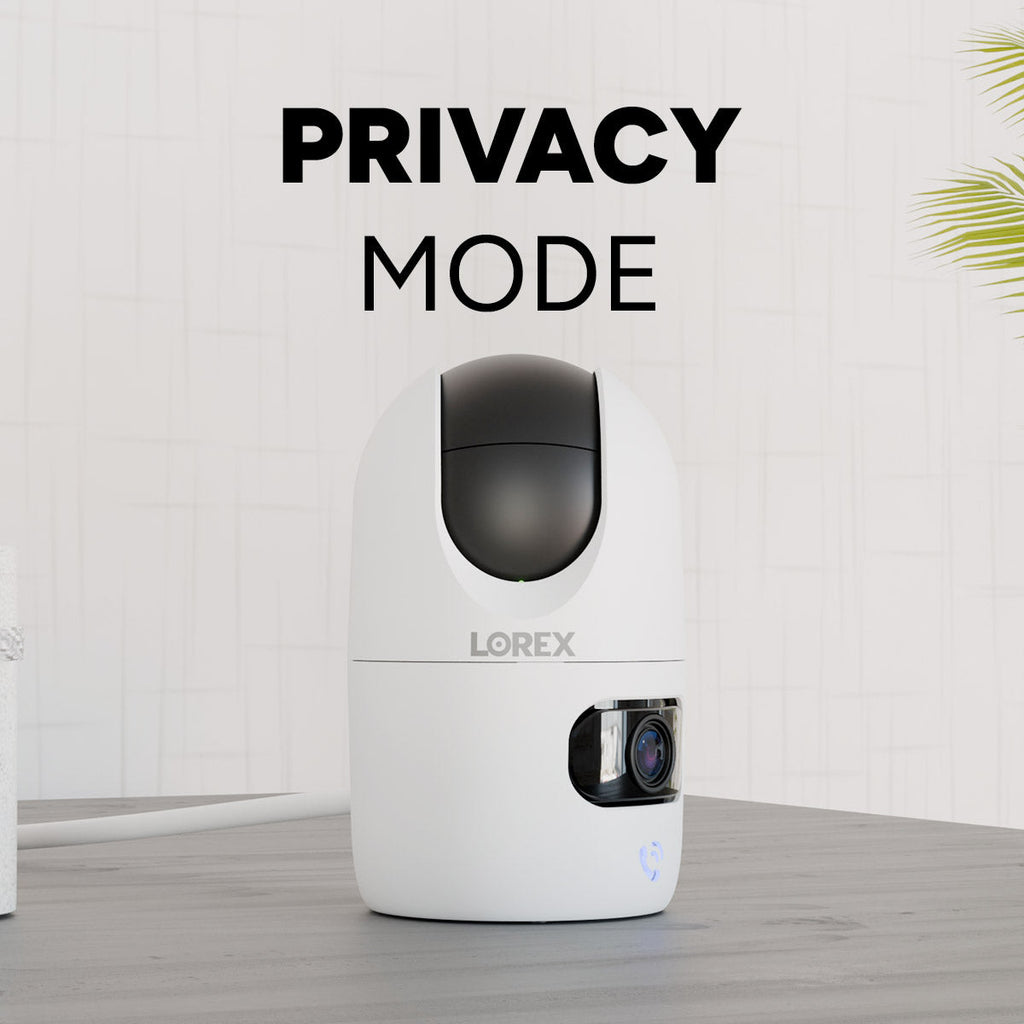 Lorex Connect indoor camera in privacy mode with white body and black top lens housing on a pale background