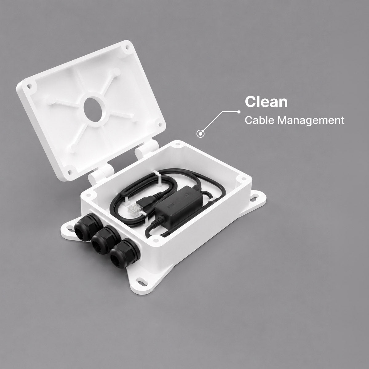 Open white cable management box showing internal cables and power adapter