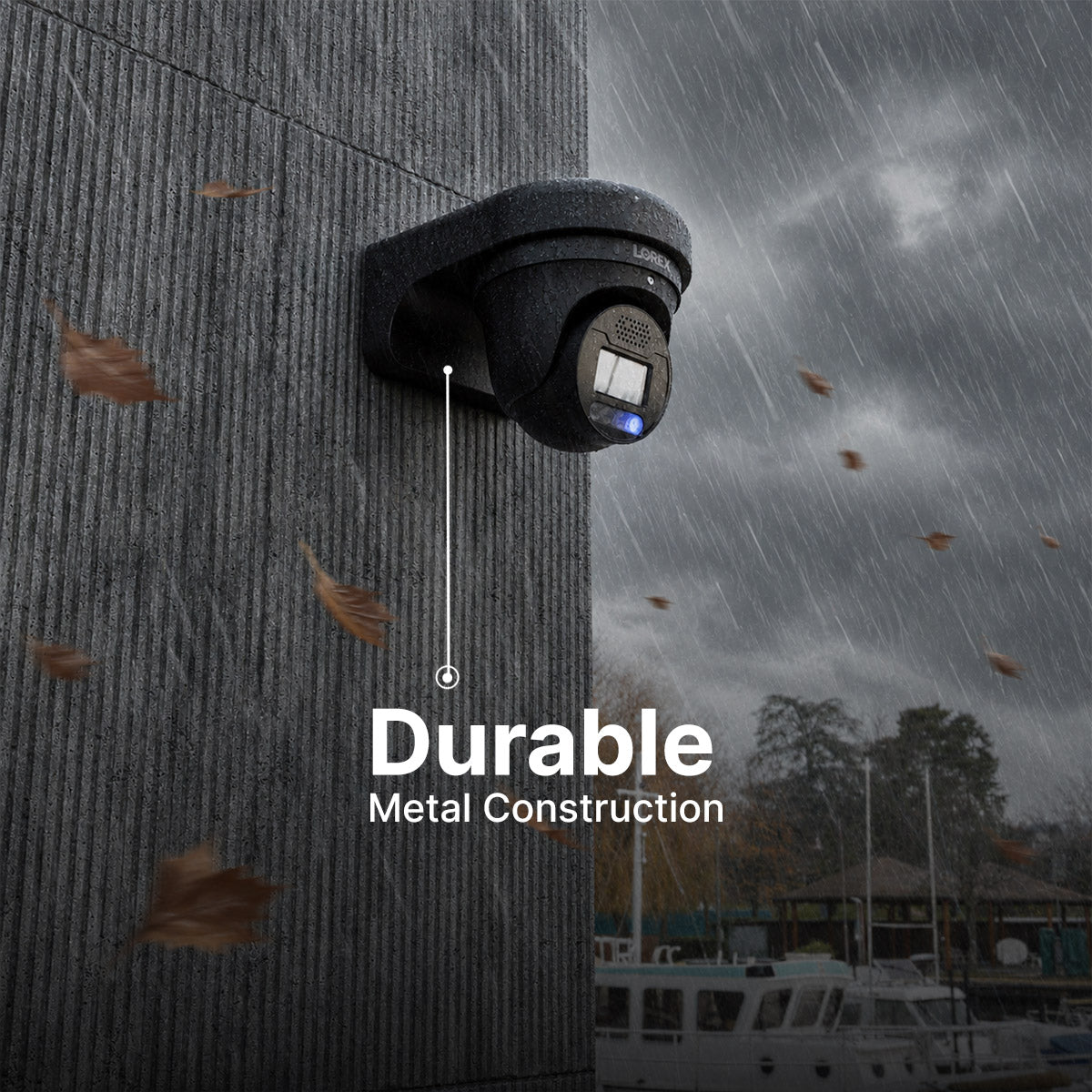 Black weatherproof security camera mounted to a rain soaked textured concrete wall