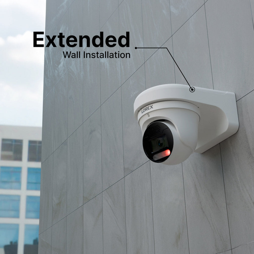 Lorex fixed dome security camera mounted on a white metal wall mount