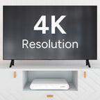 4K television on a stand with a Lorex VC 4K NVR tucked under the shelf in a modern cabinet