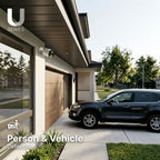 Outdoor Lorex security camera mounted on a house featuring person and vehicle detection